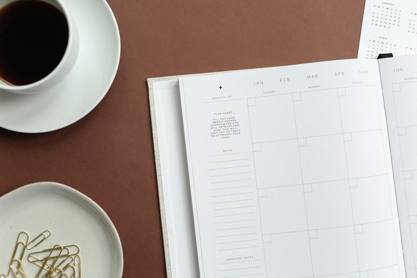 Flat lay of a book and teacup for a 30-day manifestation practice guide